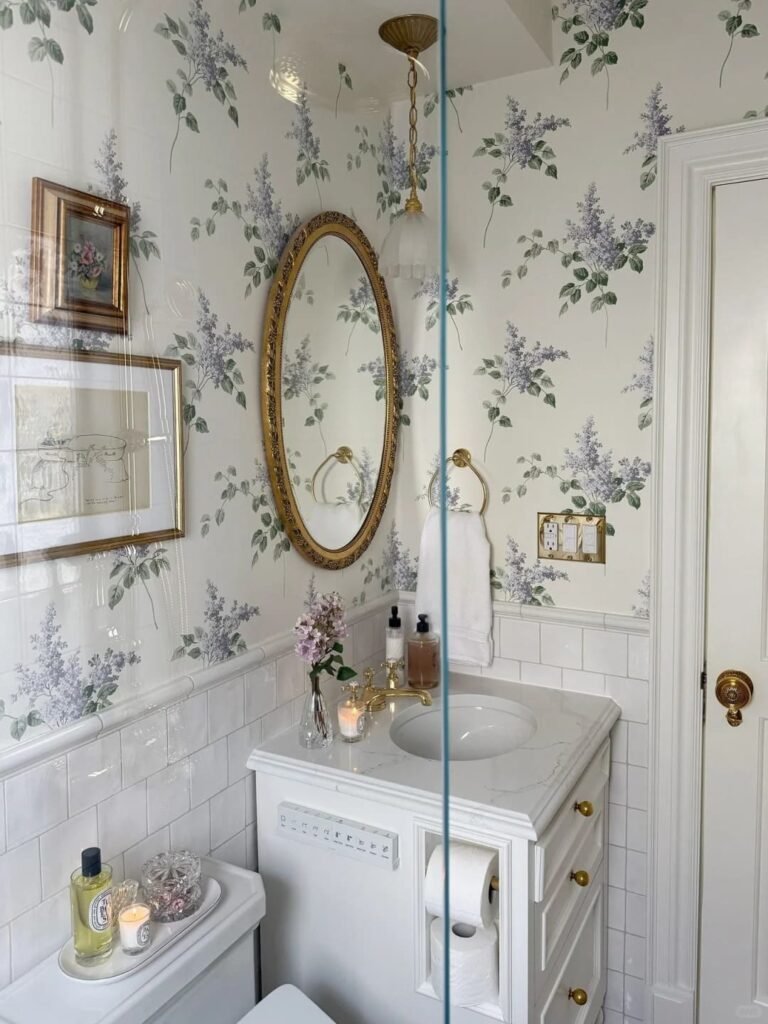Framed artwork adding personality and elegance to a beautifully styled small bathroom.