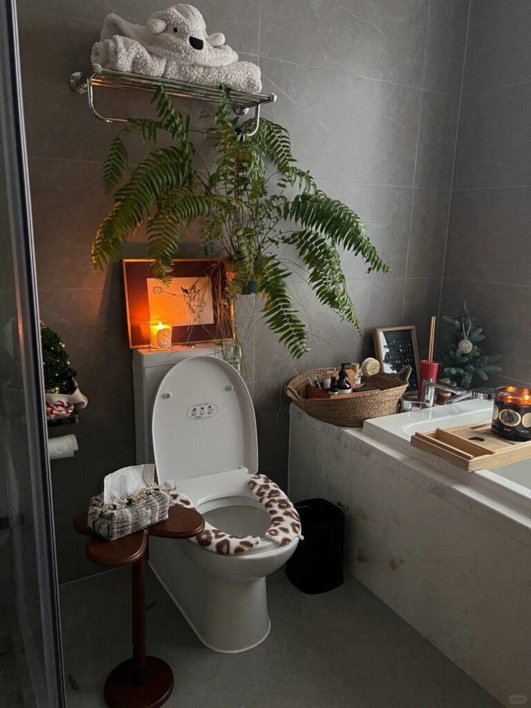 Small bathroom painted in one rich color across walls and trim for a bold cohesive look.