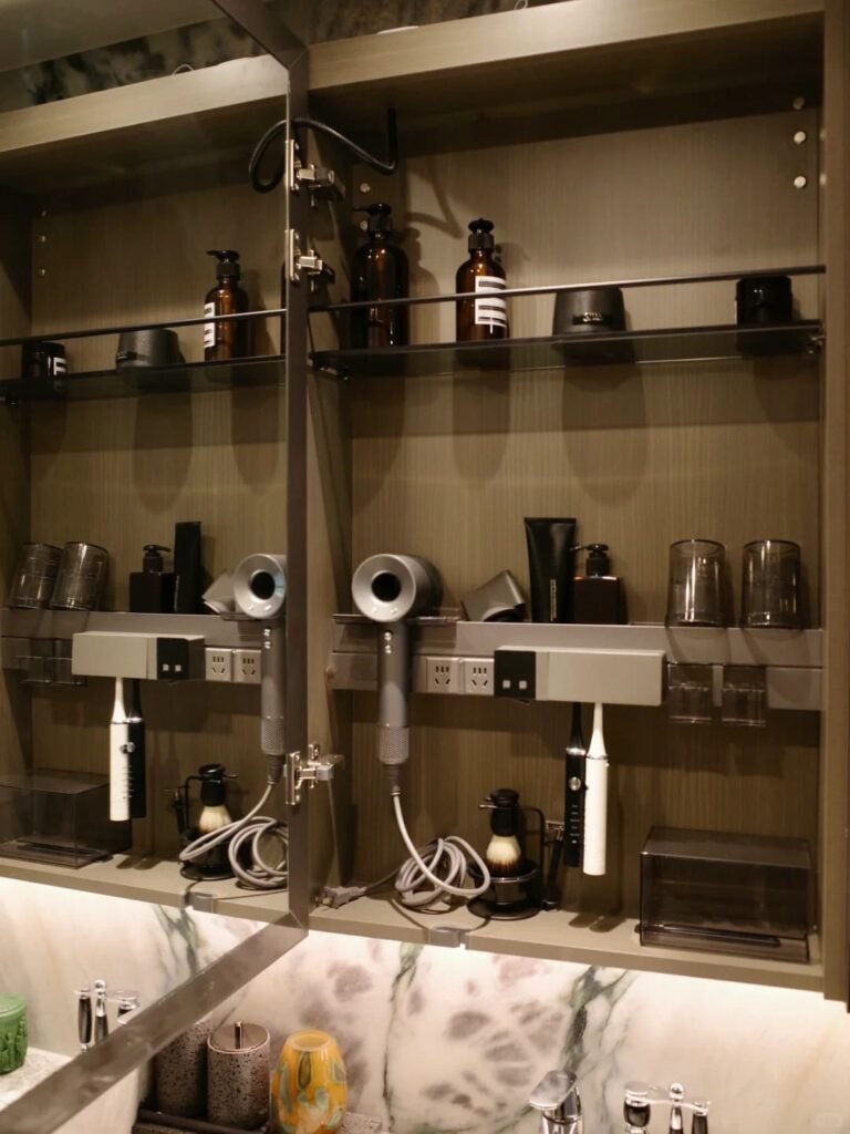 Recessed mirrored medicine cabinet with layered shelving for organized bathroom essentials.