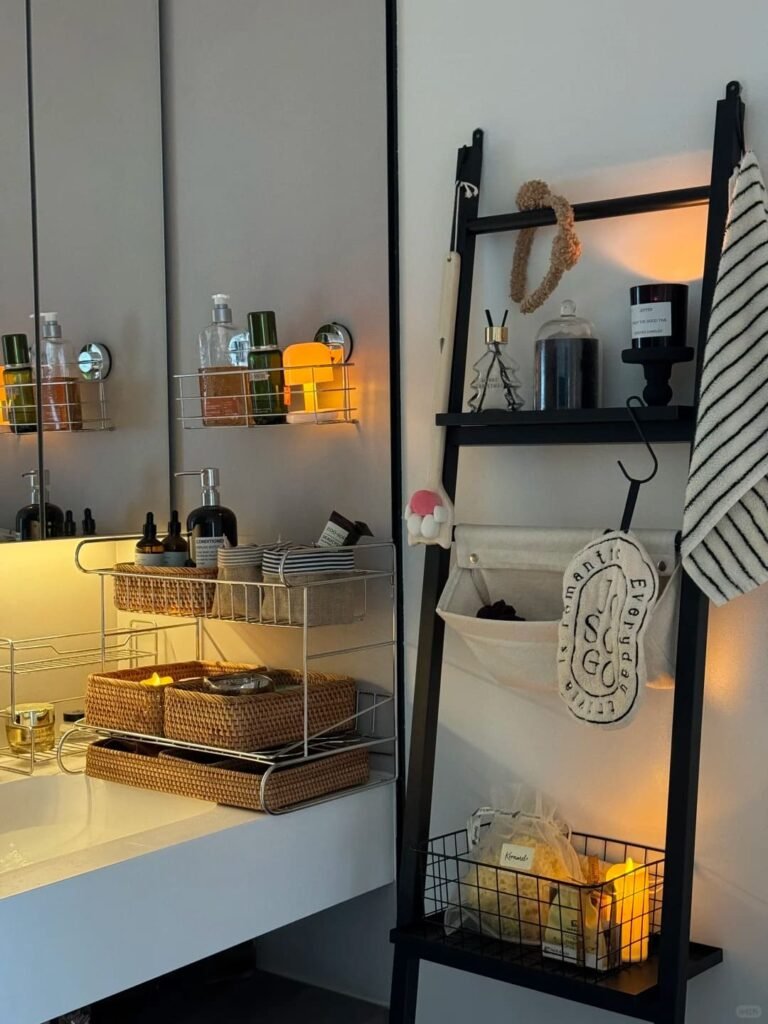 Decorative wooden leaning ladder used to store towels in a cozy small bathroom.