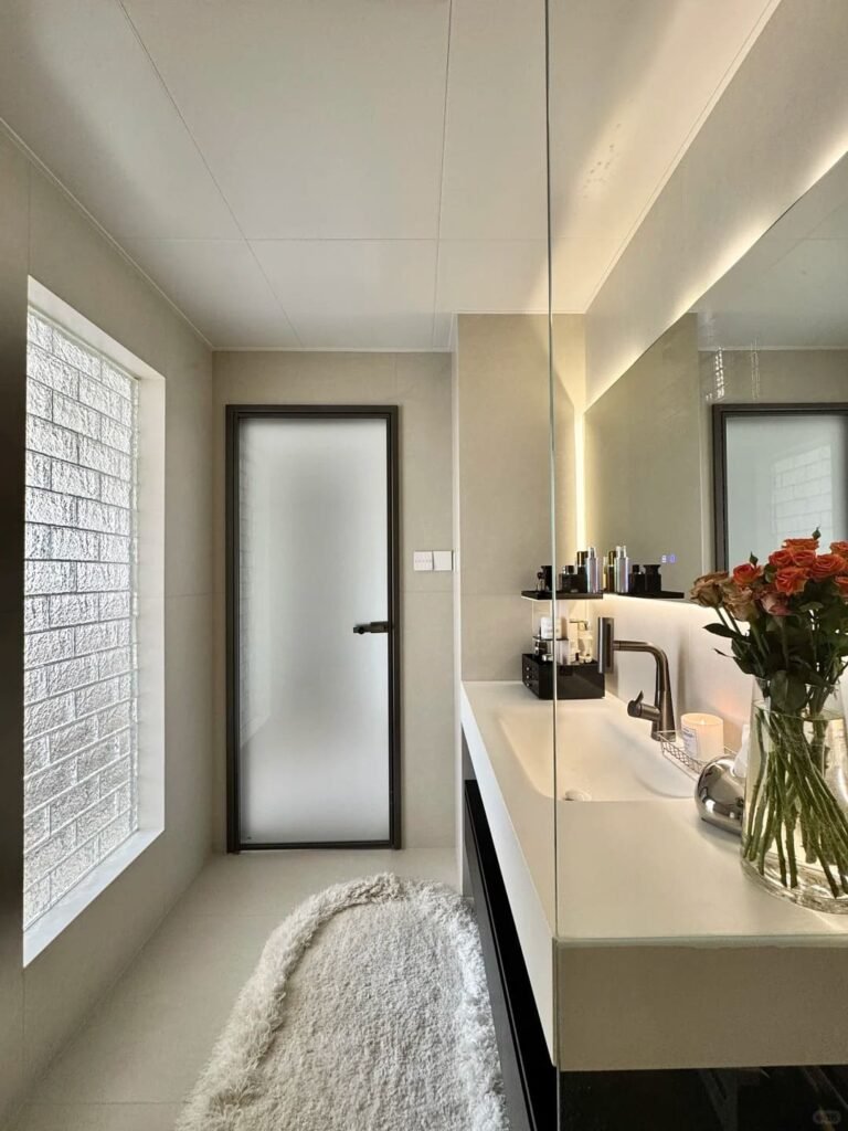 Warm monochromatic bathroom with matching walls, tiles, and decor for a cozy luxurious feel.