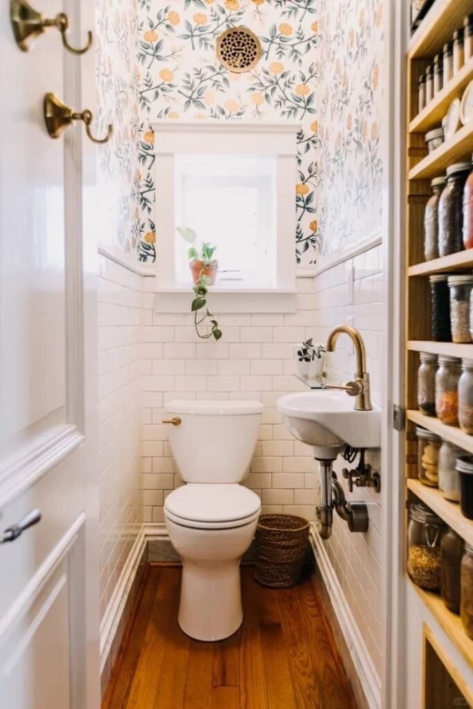 Small bathroom with patterned wallpaper covering the ceiling for a dramatic designer look.