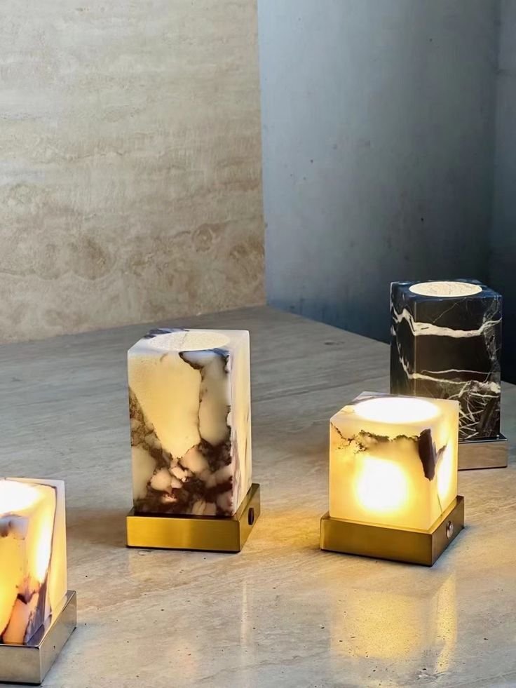 Translucent alabaster stone cube emitting a soft, warm glow, highlighting natural veining and adding a minimalist, elegant touch to a tabletop or shelf - Bedroom Lighting Ideas.