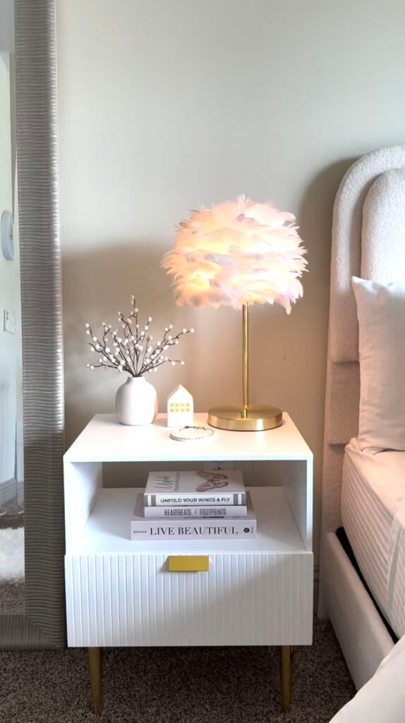 A high-gloss white lacquer nightstand with a reflective, mirror-like finish for a clean and polished modern look.