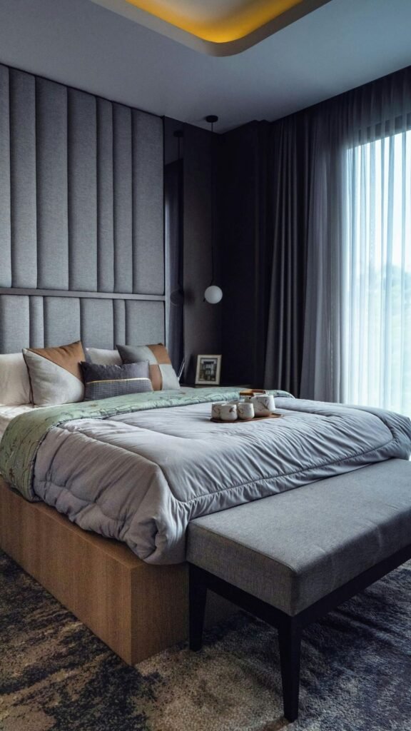 Inspirational modern bedroom featuring a deep olive and charcoal mineral-tone rug anchoring a bright white cloud bed.