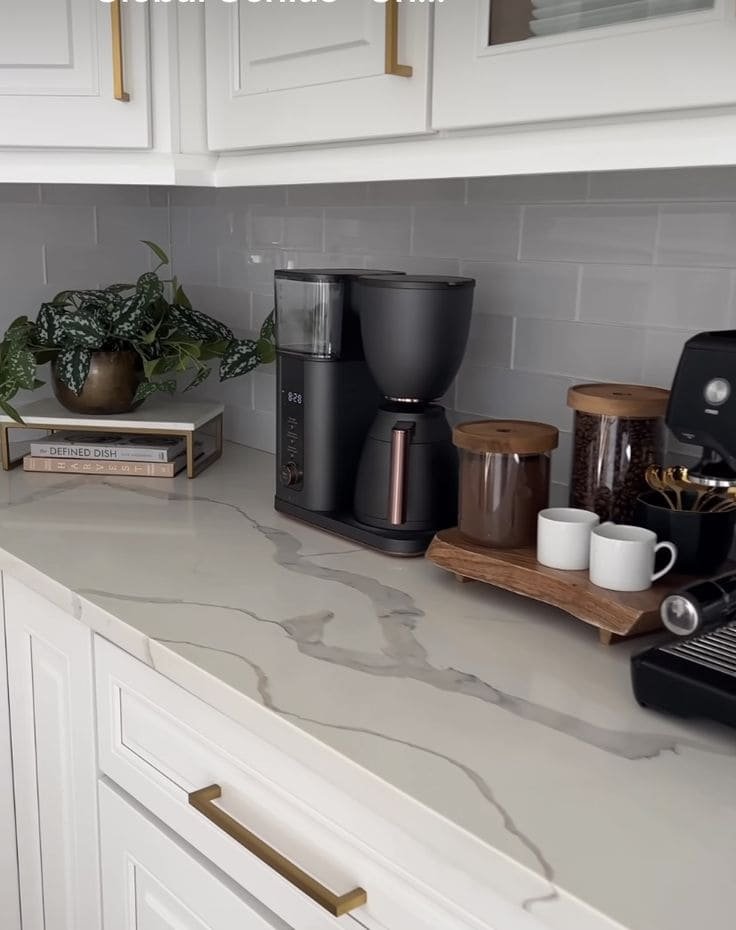 A dedicated coffee station, including a matte espresso machine and grinder