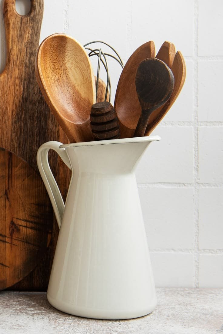 Corner vignette with a pedestal bowl and candle, using dead space for kitchen counter decor
