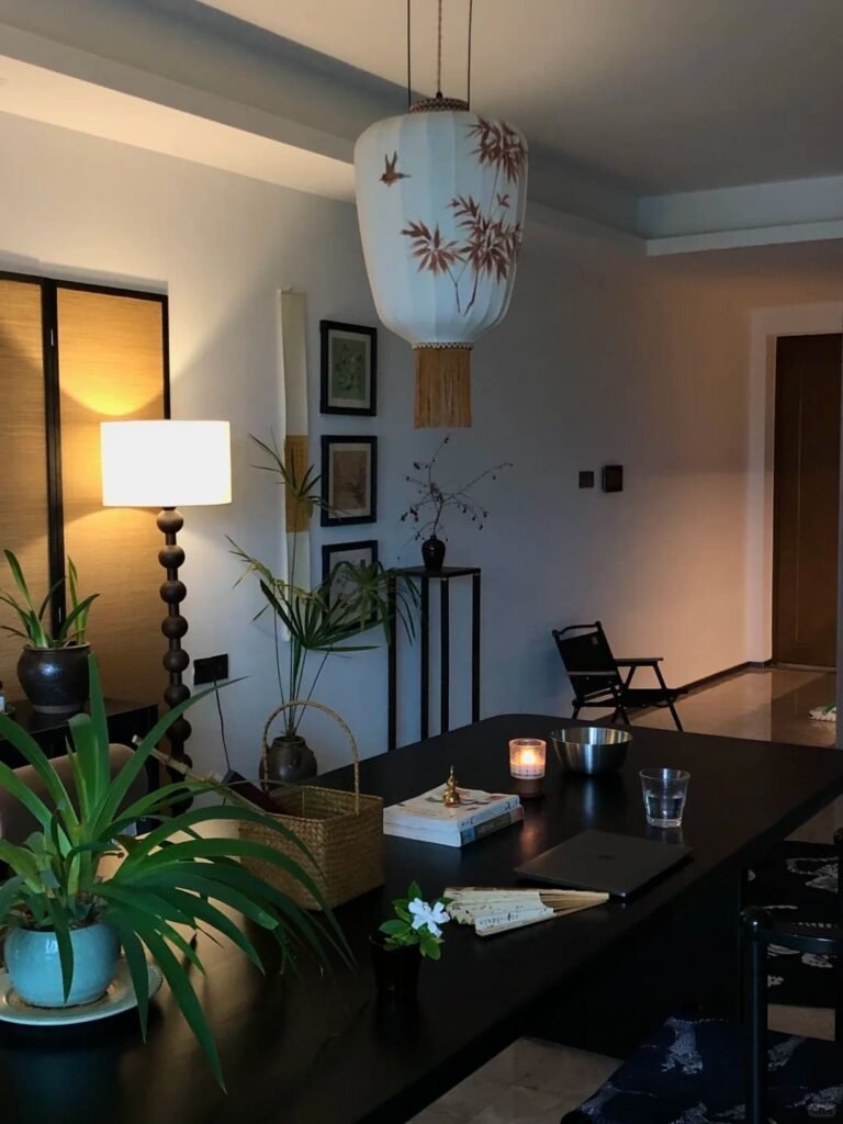 Cozy home office illuminated by a warm floor lamp instead of harsh overhead lighting.