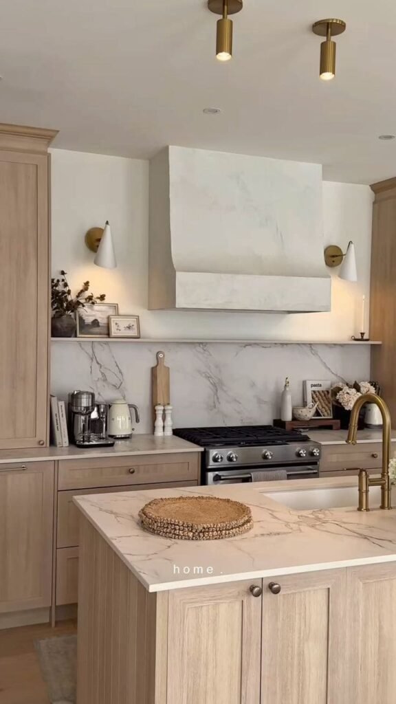 Honed marble slab backsplash with soft veining as a luxurious kitchen backsplash idea