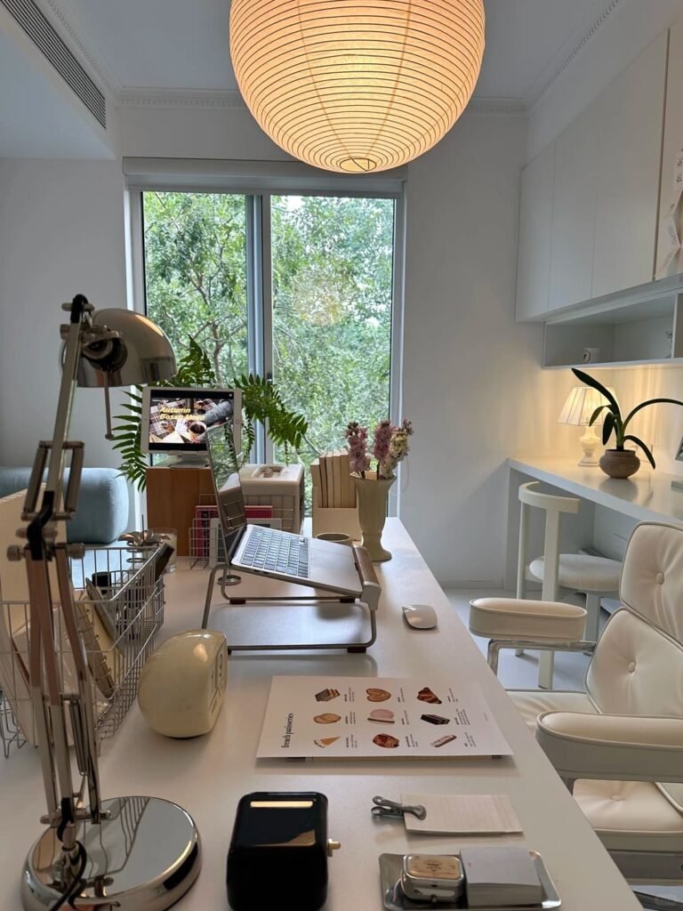 Monochromatic home office featuring matching beige furniture, decor, and accessories for a calm workspace.
