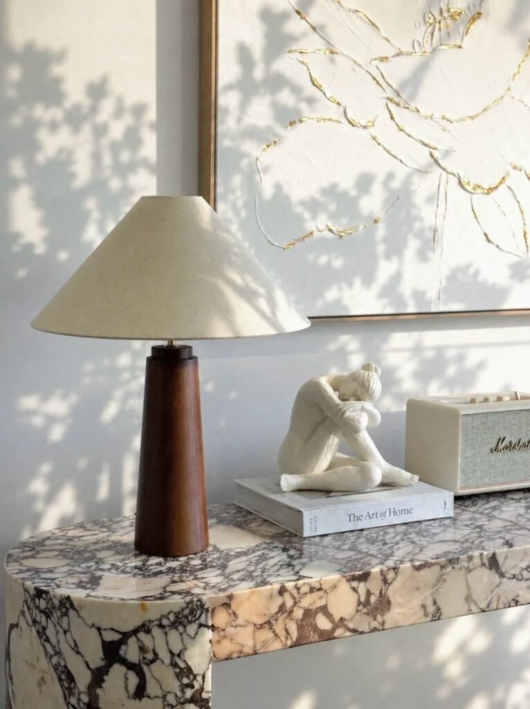 Modern coffee table featuring a sculptural decorative object as the centerpiece.

