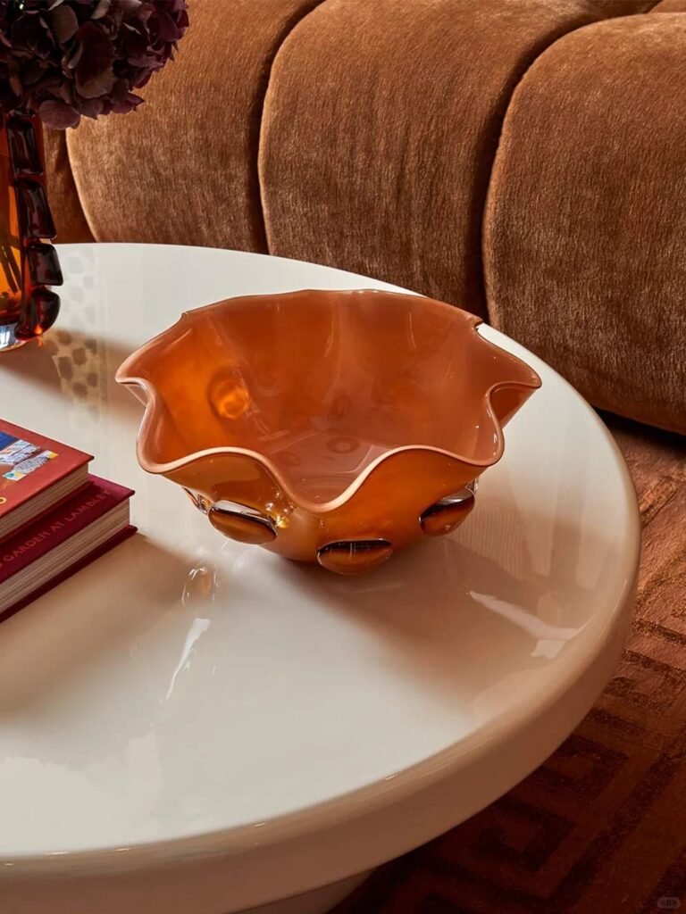 Coffee table with a decorative bowl for storing keys, glasses, and everyday essentials.
